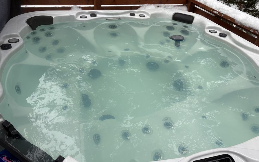 Mountain hot tub with cloudy water